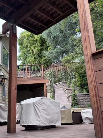 Covered wood deck structure with seating