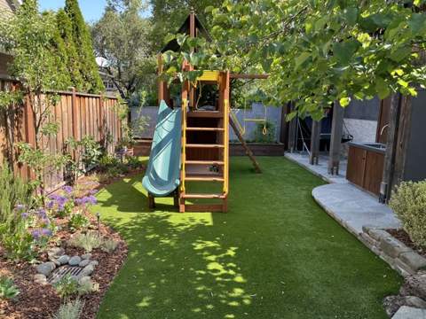 Artificial turf backyard play lawn with children's play structure